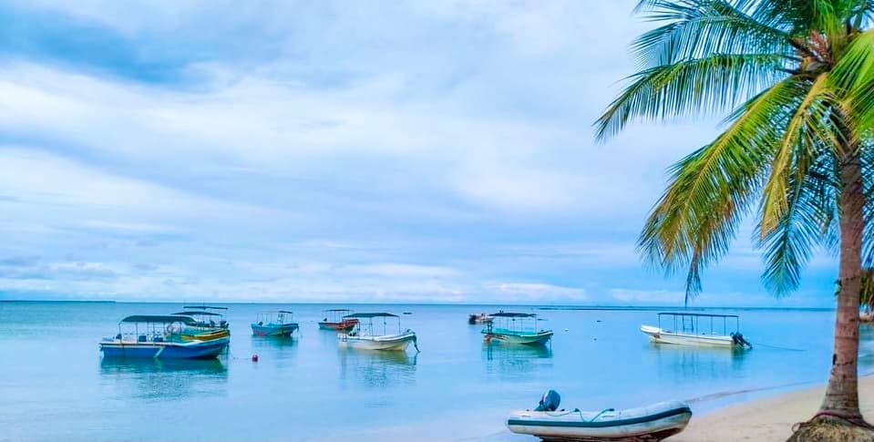 Traditional fishing boats moored on calm turquoise water