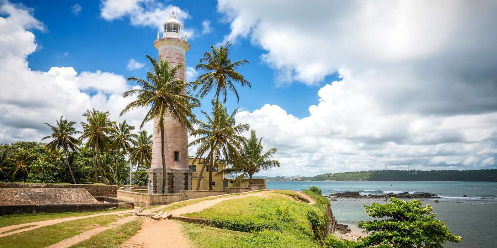 The lighthouse and ramparts of Galle Fort by the ocean